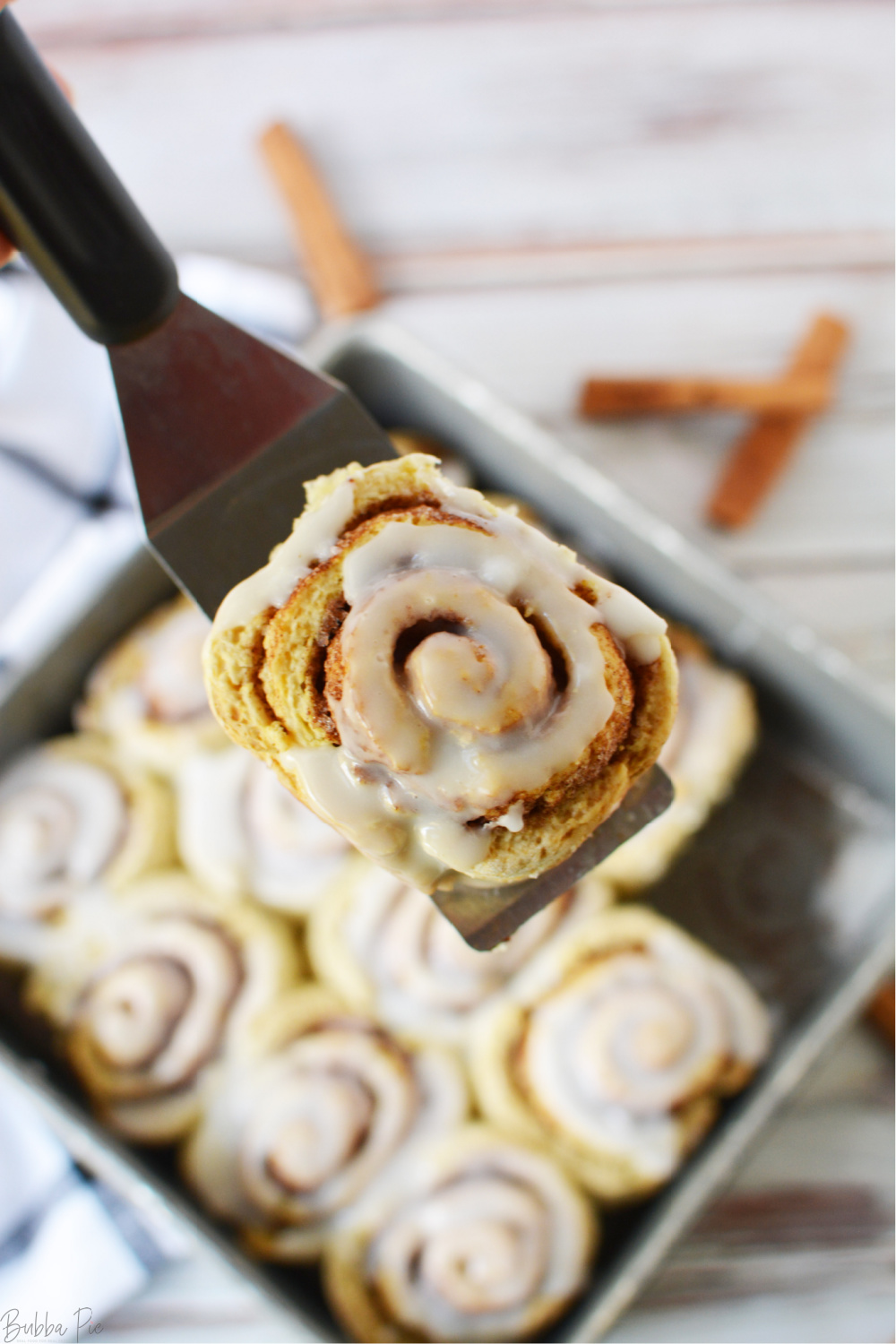 Easy Bisquick Cinnamon Rolls being served after baking in the oven.