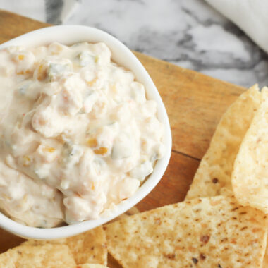 Fiesta Corn Dip being served on a platter with Tortilla Chips