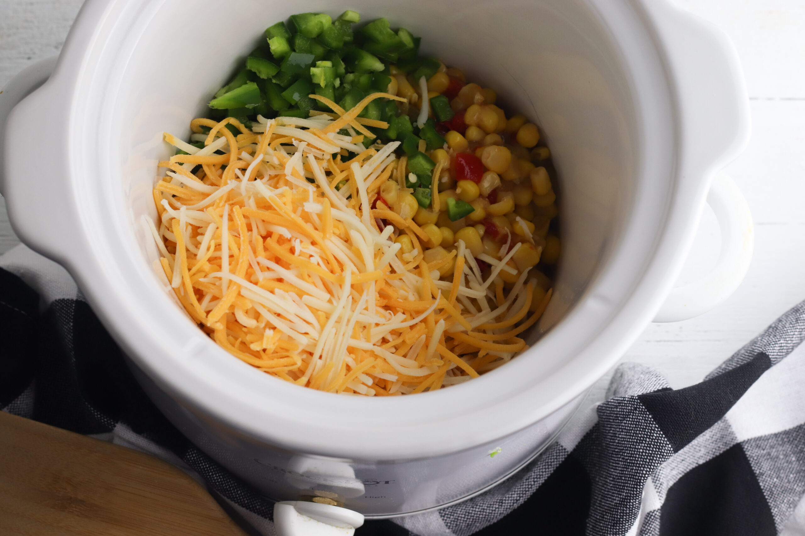 Slow Cooker Fiesta Corn Dip has cheese, jalapenos and cream cheese.