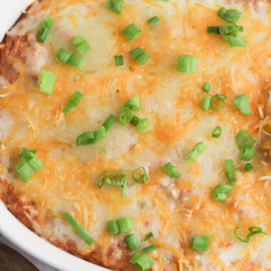 Texas Trash Dip is a cheesy mexican bean dip that is great to serve a crowd.