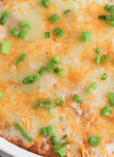 Texas Trash Dip is a cheesy mexican bean dip that is great to serve a crowd.