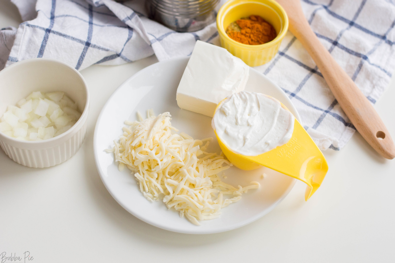 Hot Corn Dip Ingredients are cream cheese, yogurt and cheddar cheese. 