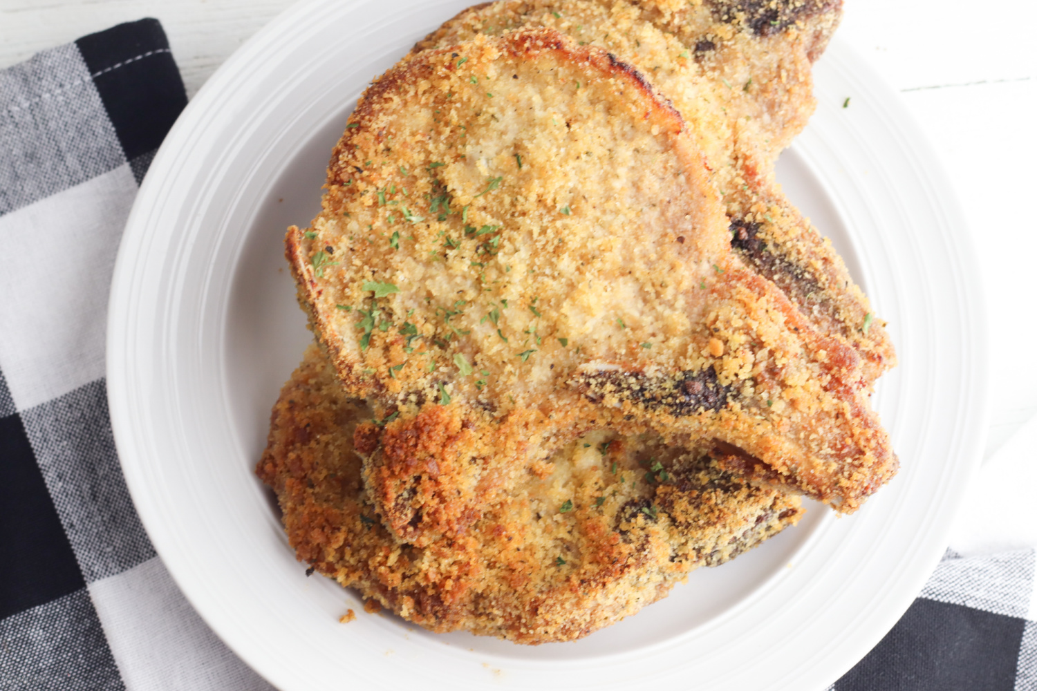 Shake and Bake Pork Chops being served on a plate for dinner.