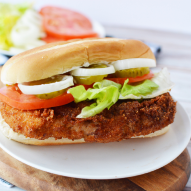 Indiana Pork Tenderloin Sandwich being served on a plate.