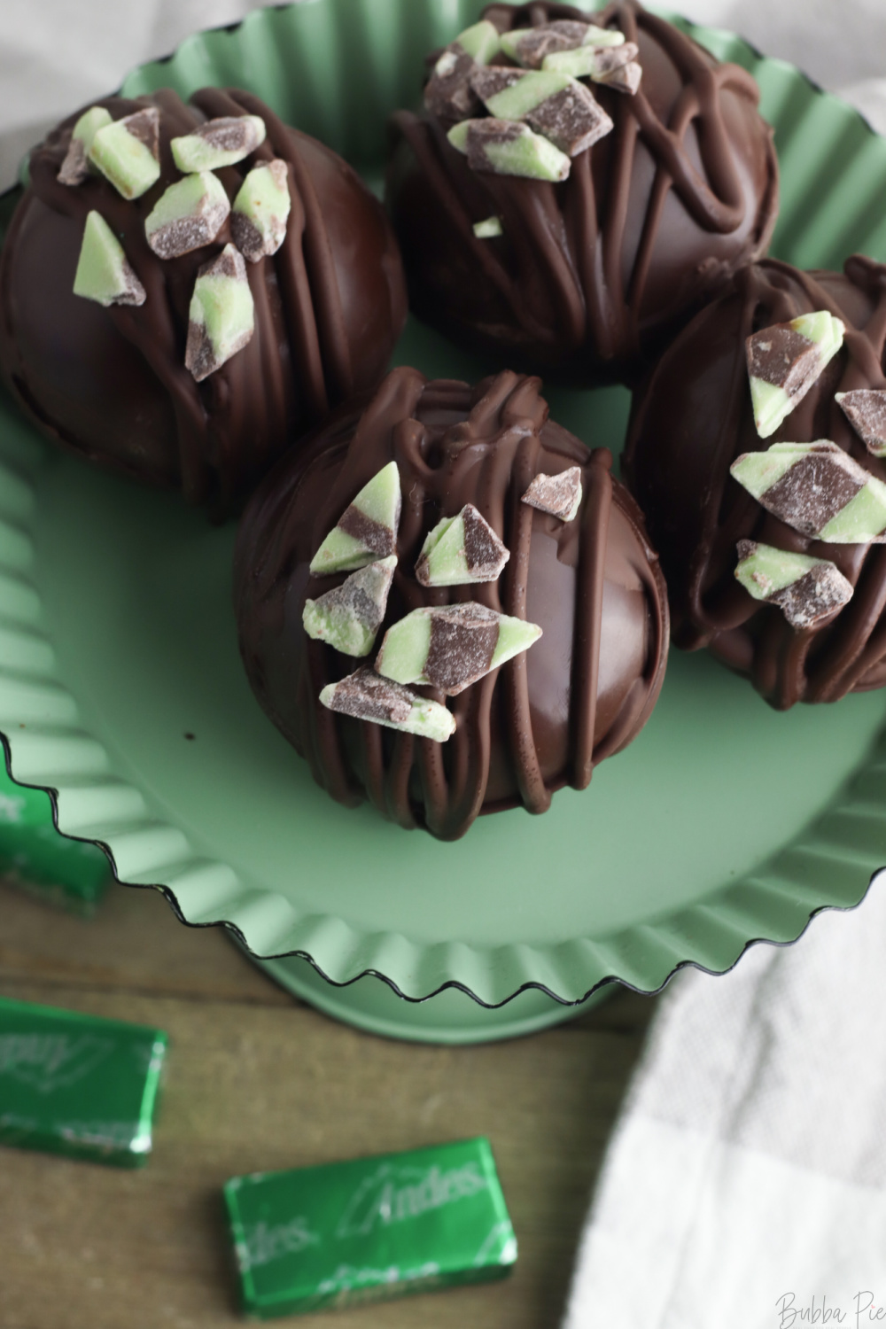 Mint Hot Chocolate Bombs being served on a plate