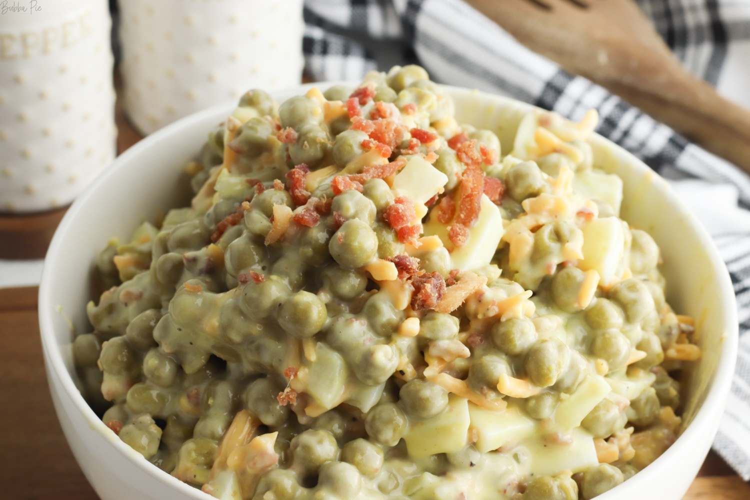 Classic Pea Salad with chopped bacon on top.