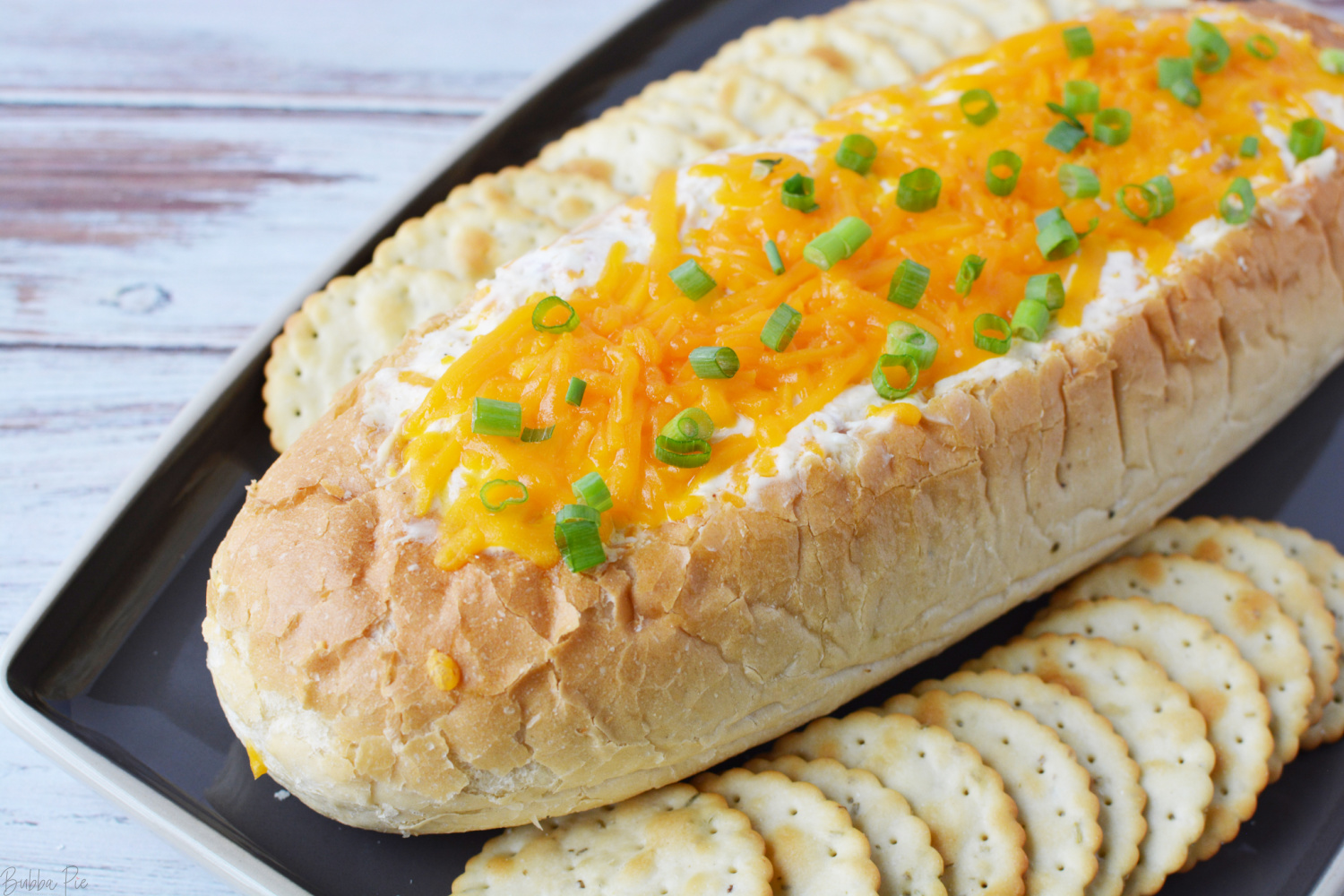 Mississippi Sin Dip being served with crackers for a game day party.