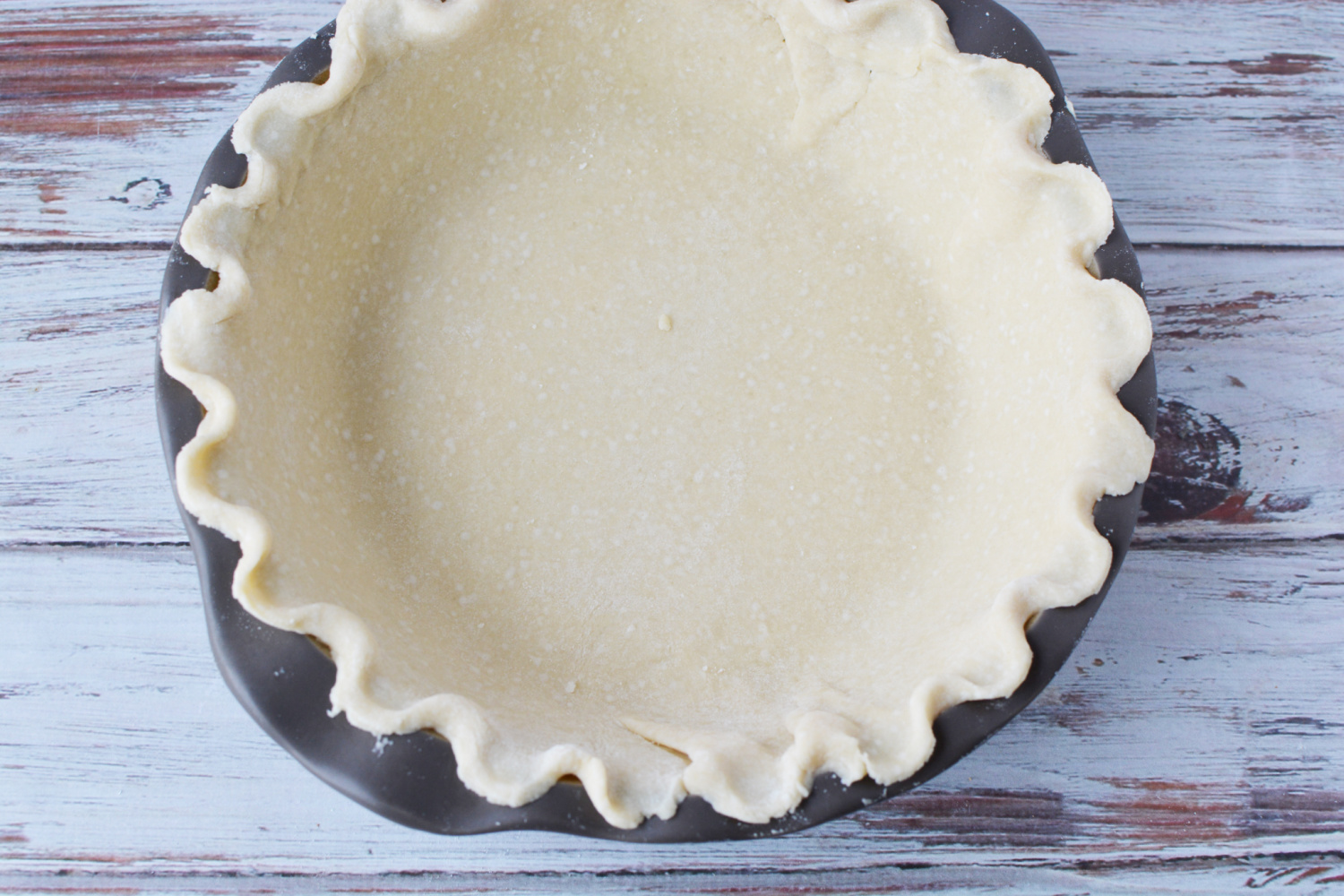 Preparing the premade pie crust for Toll House Pie