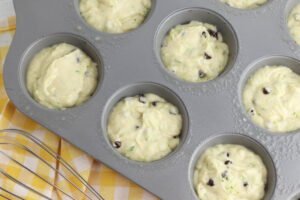 pouring batter in muffin pan.