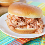 Chipped Ham Sandwich being served on a white plate.