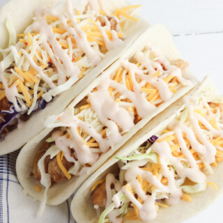 Fried Chicken Tacos with cheese and lettuce.