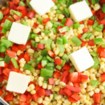 Vegetables and butter in skillet to make fiesta corn.