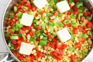 Vegetables and butter in skillet to make fiesta corn.