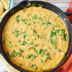 Chili Cheese Dip being served with tortilla chips.