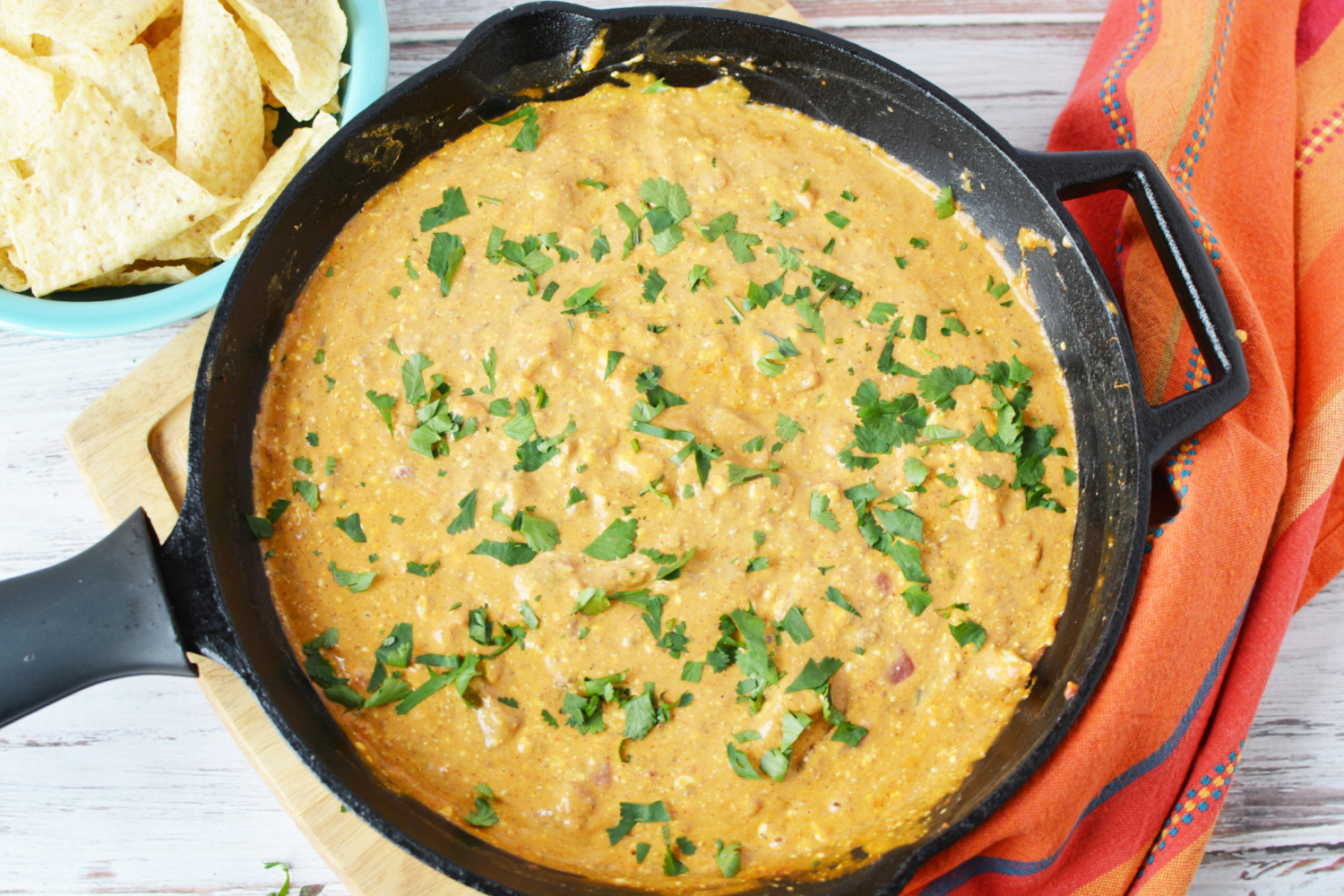 Chili Cheese Dip being served with tortilla chips.