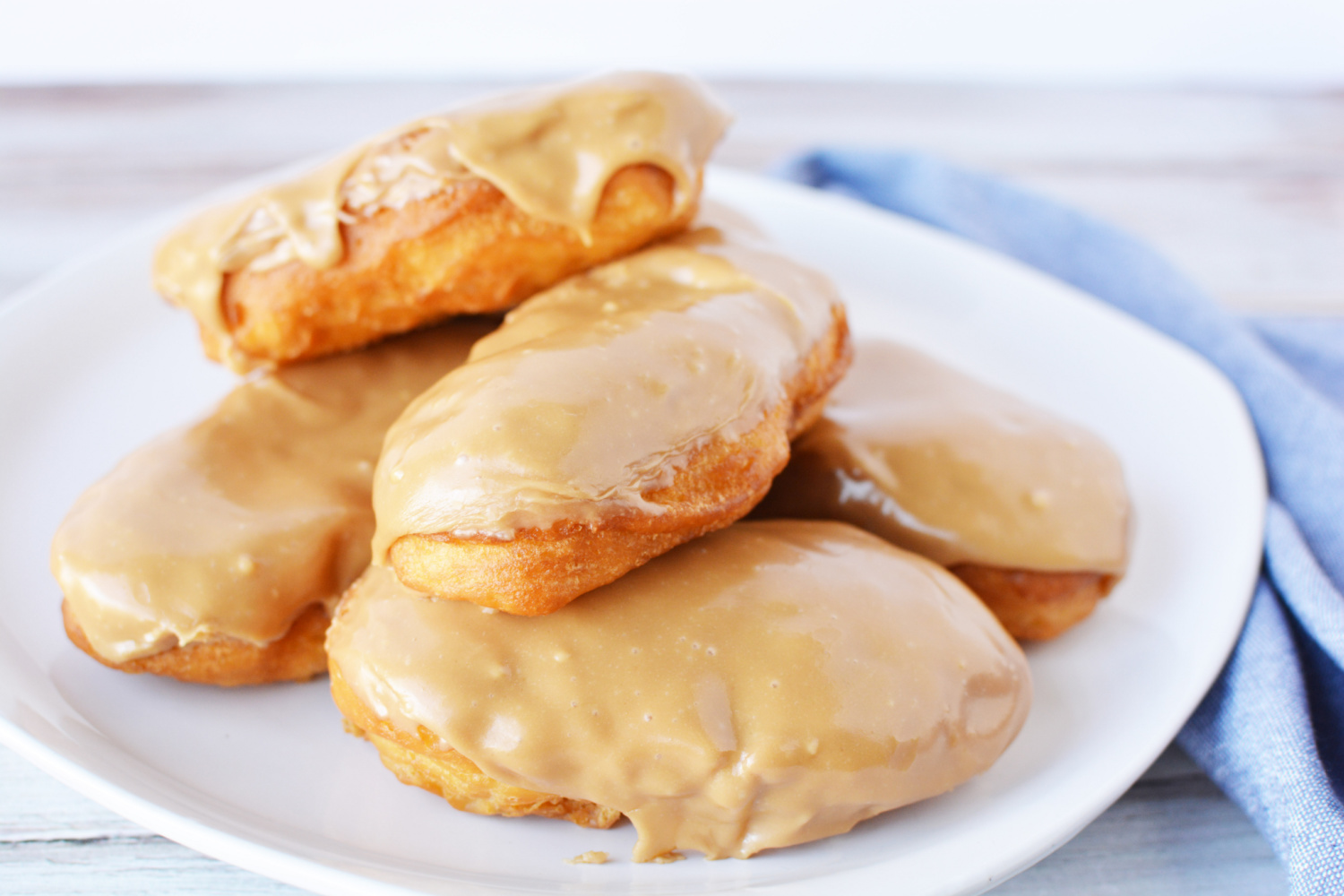 Homemade Maple Bars on a white plate.