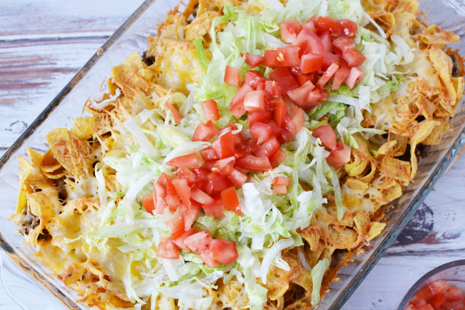 Top with shredded lettuce and diced tomatoes