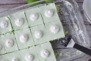Lime Jello Salad with whipped topping in a casserole dish