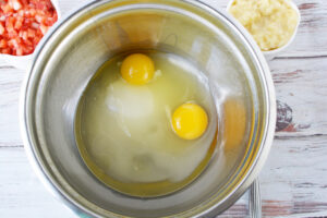 Combine vegetable oil, sugar and eggs.