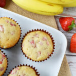 Strawberry Banana Muffins in a muffin tin coming out of oven.
