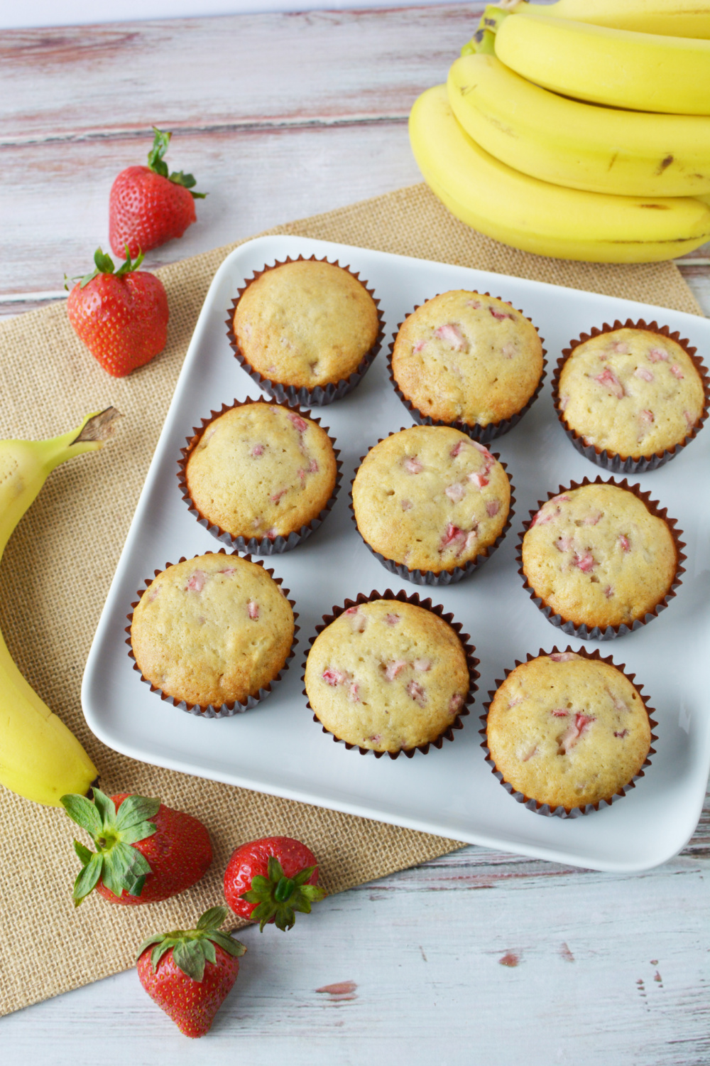 Strawberry Banana Muffins Recipe cooling on baking pan.