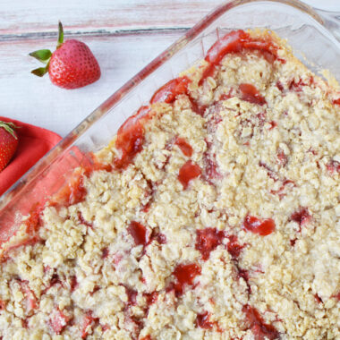 Strawberry Crumble being served in a casserole dish.