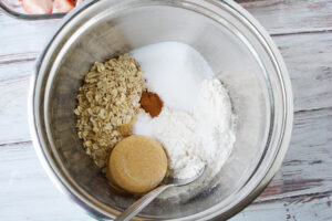 combine oats, brown sugar, flour and cinnamon