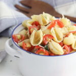 Bruschetta Pasta Salad sitting in a white bowl.