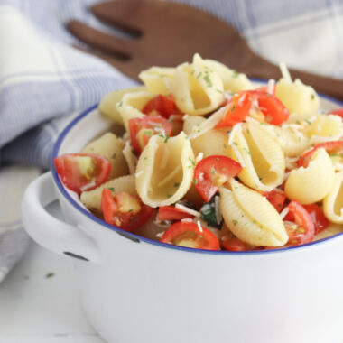 Bruschetta Pasta Salad sitting in a white bowl.