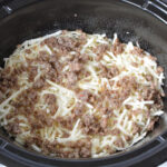 Topping hash browns with sausage