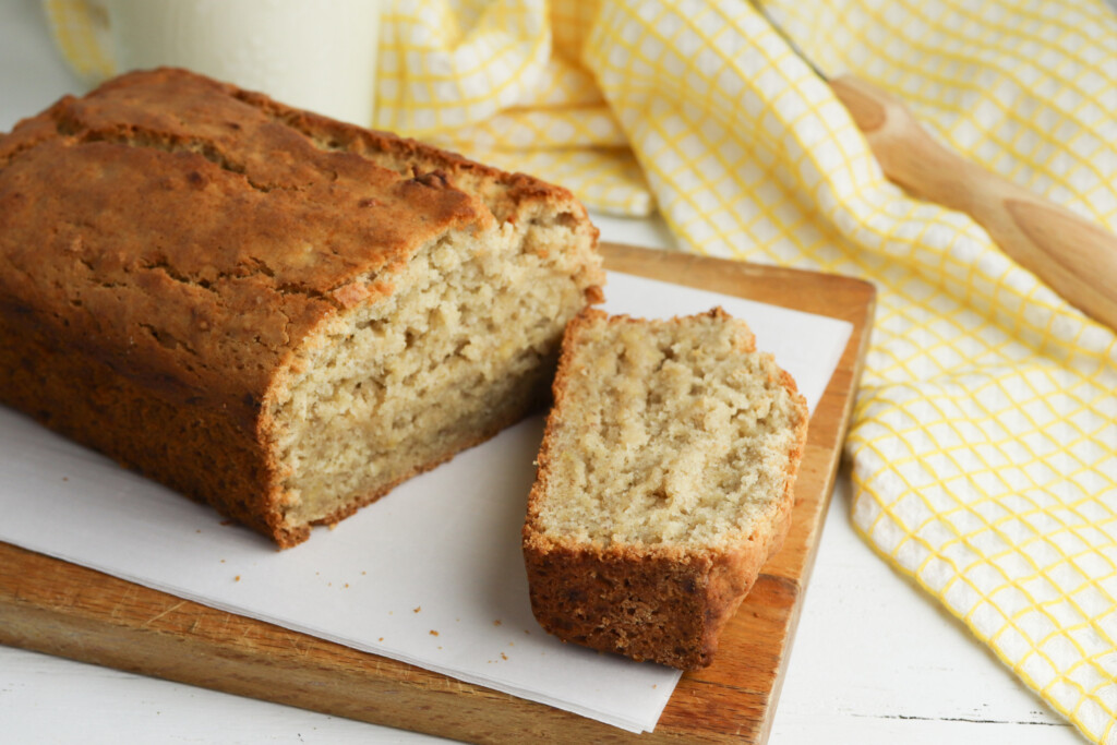 2 banana bread being slice for serving