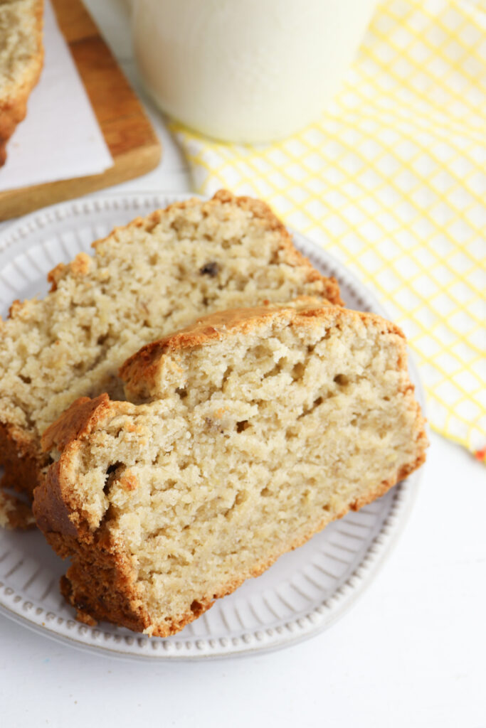 Banana bread slices on a white plate.