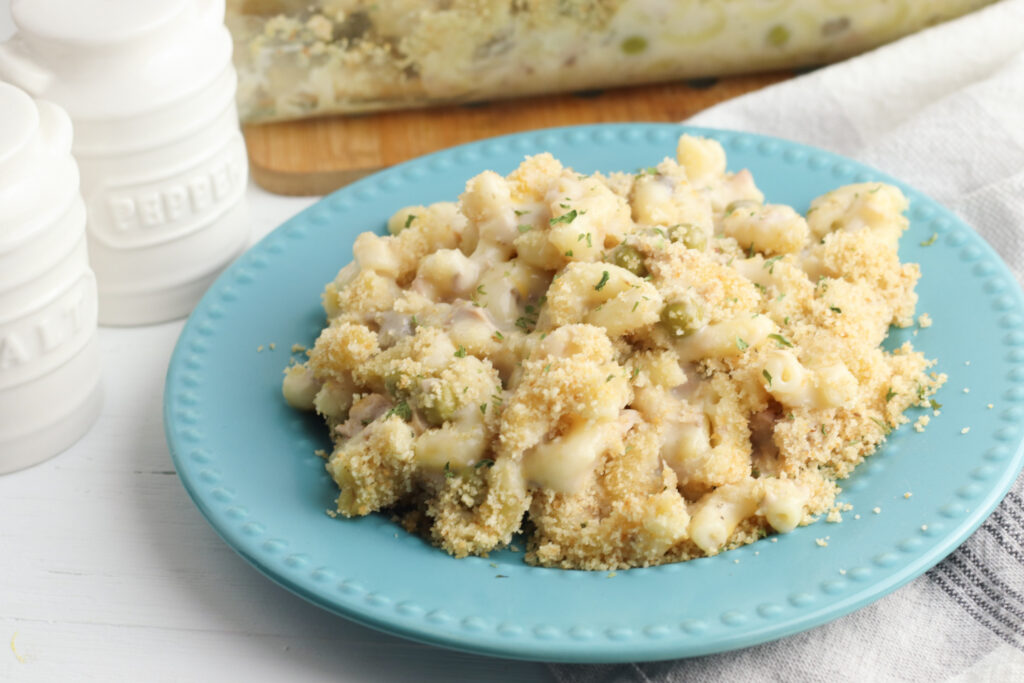 Tuna Noodle Casserole Recipe sitting on blue plate.