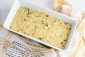 pour banana bread batter into loaf pan