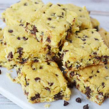 Cake Mix Cookie Bars piled on a white plate.