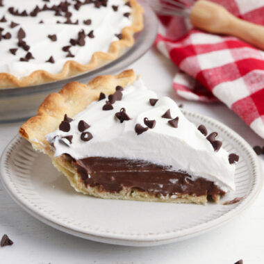 Chocolate Cream Pie being served on a white plate.