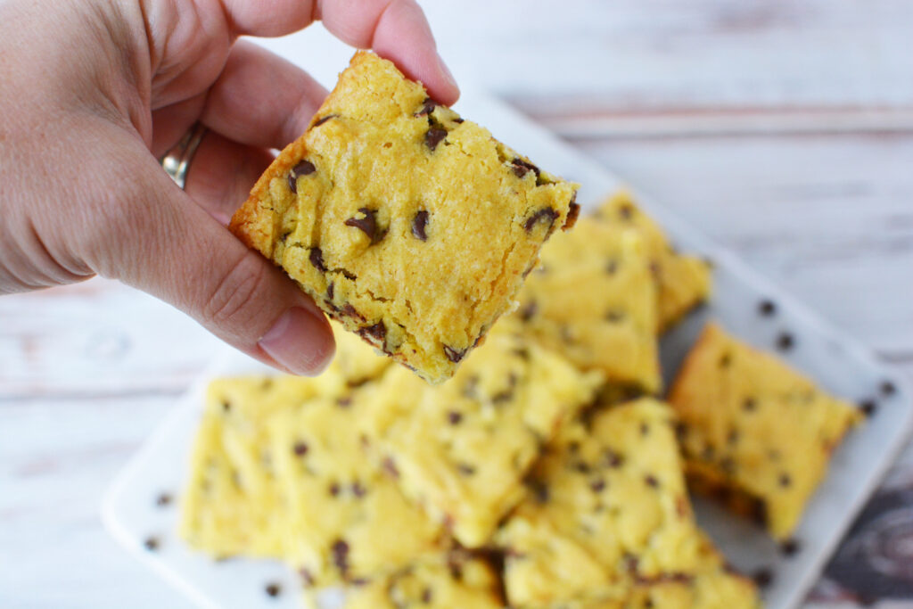 Easy cookie bars with cake mix being eaten for dessert.