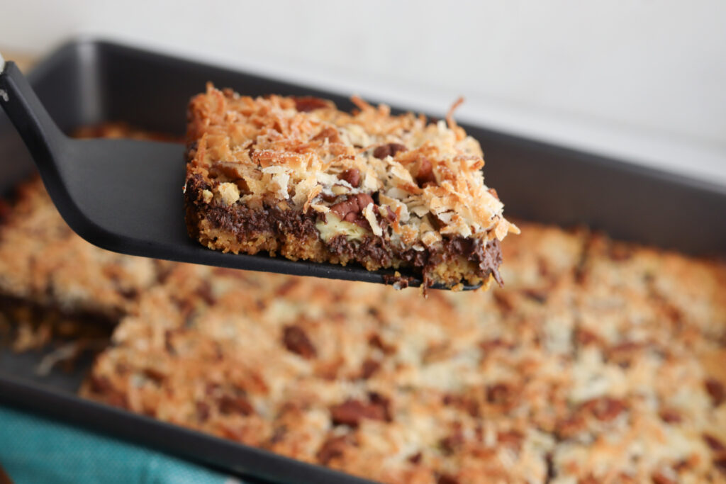 Hello Dolly Bars Being Served on a spatula.