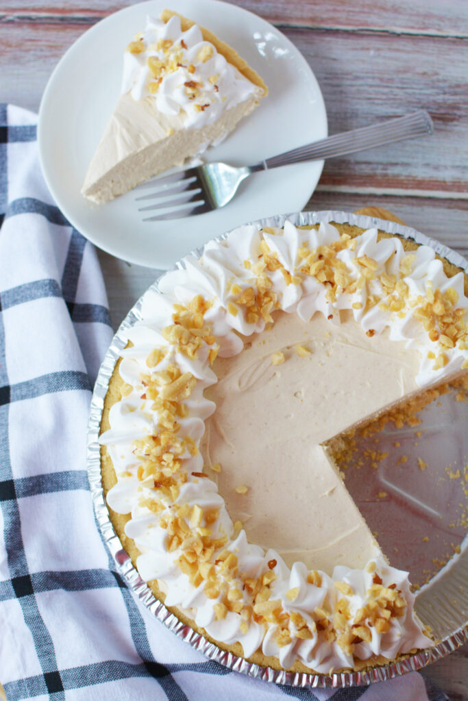 How to make peanut butter no bake pie topped with whipped cream and peanuts.