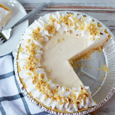 Peanut Butter No Bake Pie being served in a pie plate.