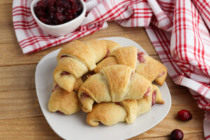 Cranberry Cheesecake Crescent Rolls on a white plate.