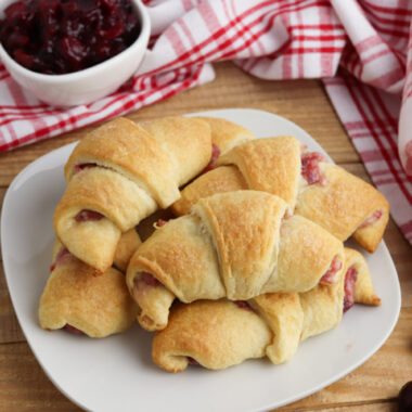 Cranberry Cheesecake Crescent Rolls on a white plate.