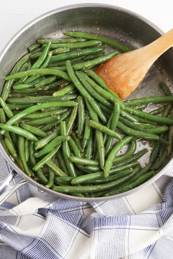 Saute green beans with garlic and butter.