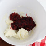 Mix cranberry sauce with cream cheese.