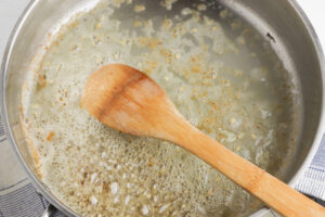 Saute butter and garlic in skillet.