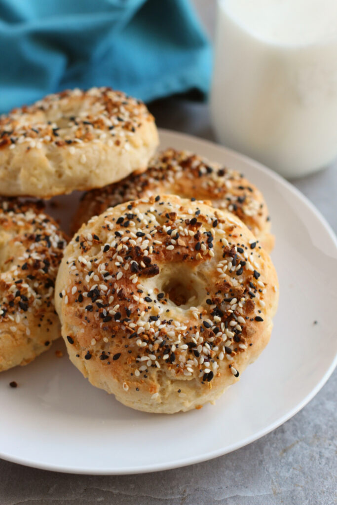 2 ingredient bagels stacked on a white plate.