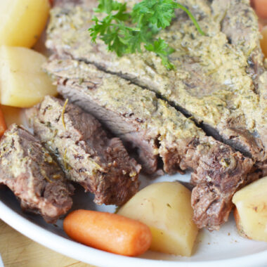 Slow Cooker Chuck Roast being served for dinner.