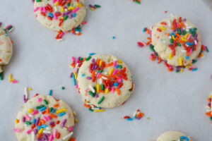 Baking Funfetti Cookies on a cookie sheet