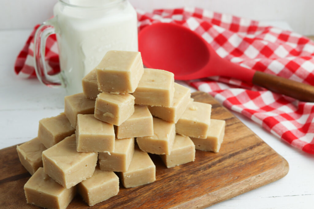 Easy Peanut Butter Fudge Recipe on a wooden cutting board