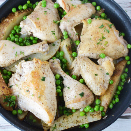 Chicken Vesuvio being baked in a skillet.